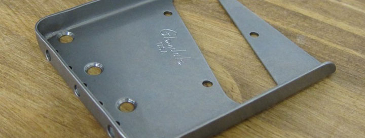 The vintage "no-cut" bridge-plate non-magnetic stainless steel The "Raw-Deal" un-polished and un-plated
